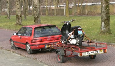 Car_and_trailer_with_motorbike_Nagele.JPG